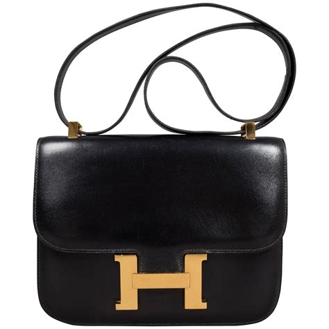 hermes black bag with perfereted h|Hermes 101 purse.